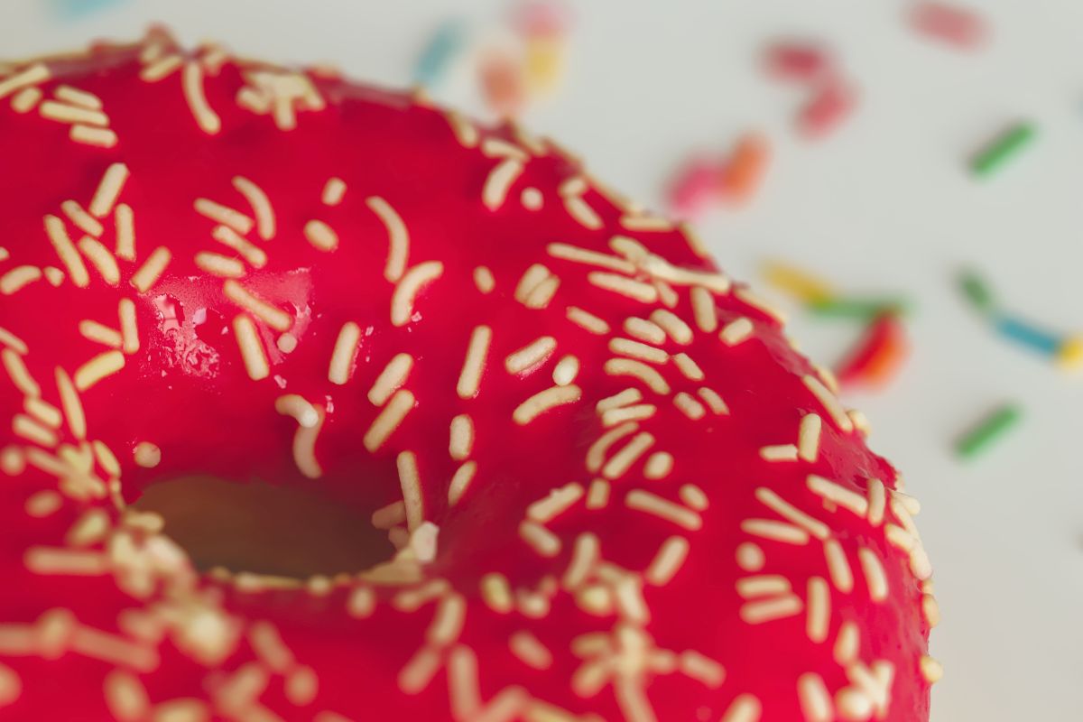 Close up shot of donut with red dye. 